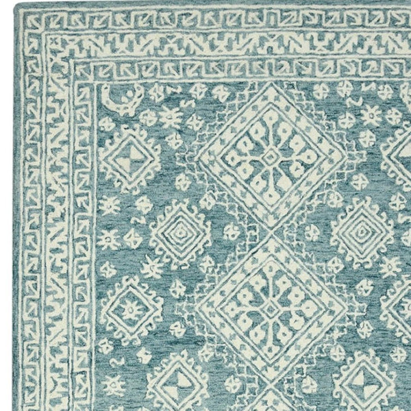 HomeRoots 5' Aqua and Ivory Wool Geometric Area Rug - Hand-Hooked Artisan Design for Modern Spaces, 60" x 90" 5' X 7' 570364