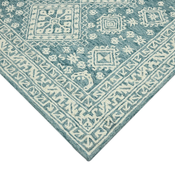 HomeRoots 5' Aqua and Ivory Wool Geometric Area Rug - Hand-Hooked Artisan Design for Modern Spaces, 60" x 90" 8' X 10' 570365