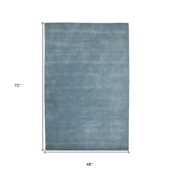 HomeRoots 4' Light Blue Hand-Woven Wool Area Rug - Luxurious, Durable, and Perfect for Any Room Decor 4' X 6' 570655
