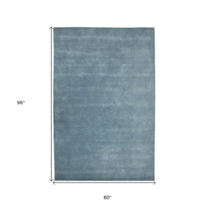 HomeRoots 4' Light Blue Hand-Woven Wool Area Rug - Luxurious, Durable, and Perfect for Any Room Decor 5' X 8' 570656