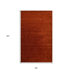 HomeRoots 5' Hand-Woven Red Wool Area Rug - Artisanal Craftsmanship, Plush Comfort, and Timeless Style for Your Home 5' X 8' 570661