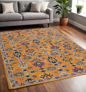 HomeRoots 5' Vibrant Floral Hand-Tufted Wool Area Rug - Artisanal Orange, Purple & Blue Design for Cozy Spaces 5' X 8' 570703