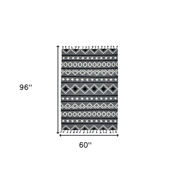HomeRoots 5' Wool Tribal Flatweave Handmade Area Rug with Fringe - Versatile Gray, White, and Black Design 5' X 8' 571080