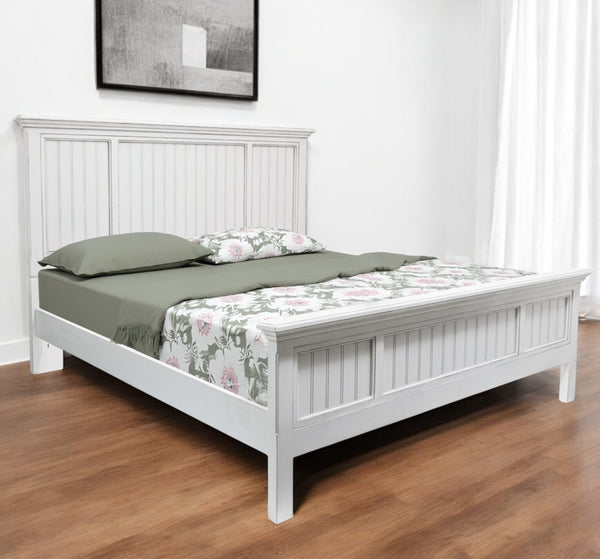 HomeRoots White Carved Geometric Distressed Solid Wood King Bed Frame - Elegant Centerpiece for Your Bedroom 571384