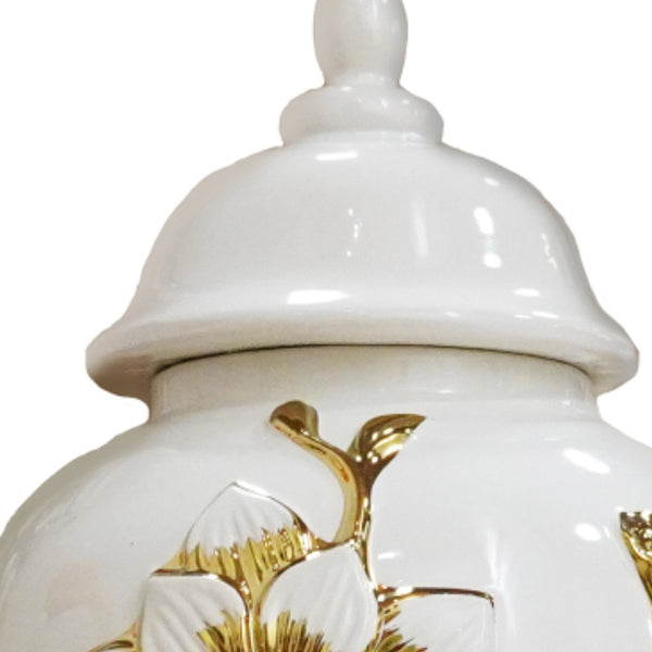Homeroots 14" White And Gold Floral Urn Ceramic Ginger Jar With Sculptural Details  Ceramic 571621