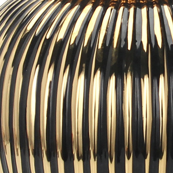 Homeroots 12" Black And Gold Striped Urn Ceramic Ginger Jar - Chic Decorative Accent For Modern Interiors  Ceramic 571631