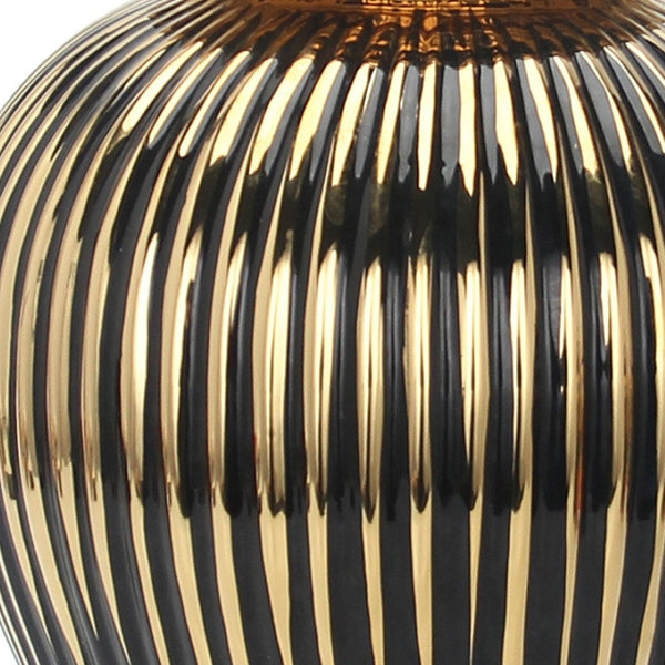 Homeroots 12" Black And Gold Striped Urn Ceramic Ginger Jar - Chic Decorative Accent For Modern Interiors  Ceramic 571631