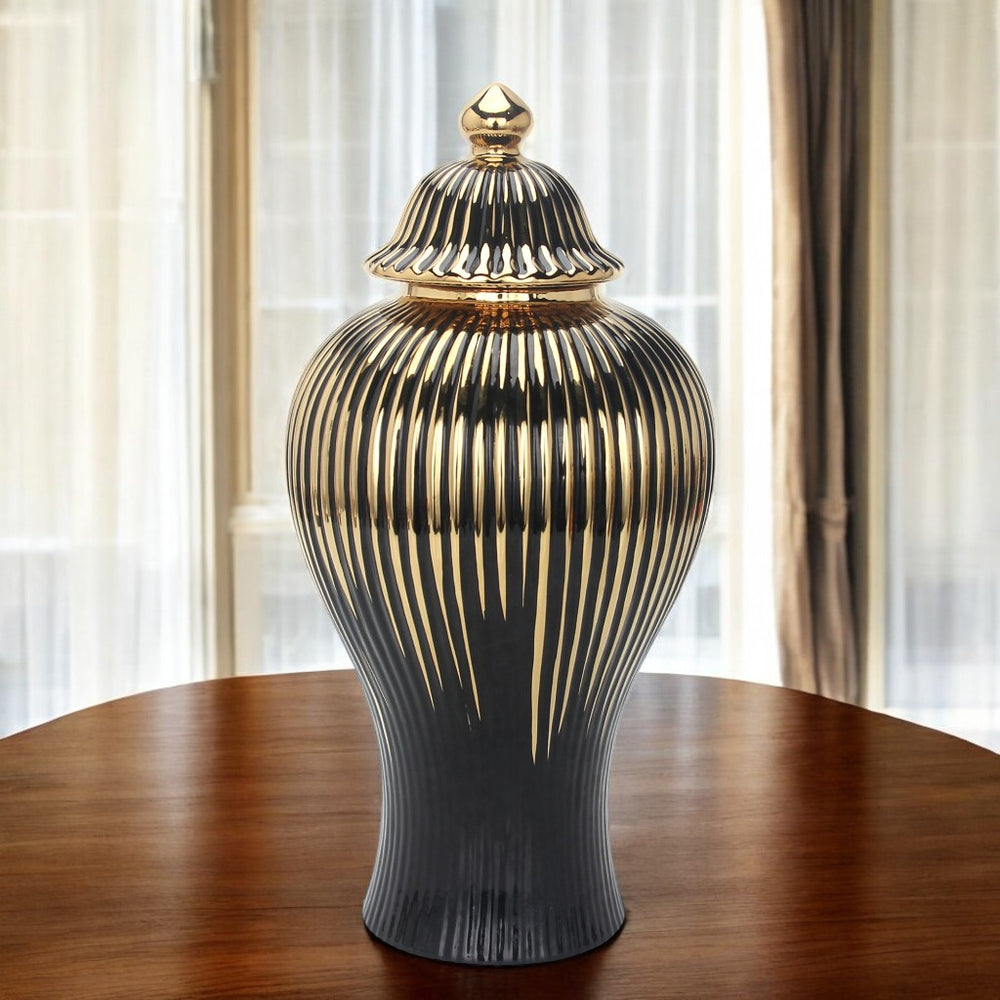 Homeroots 12" Black And Gold Striped Urn Ceramic Ginger Jar - Chic Decorative Accent For Modern Interiors  Ceramic 571631