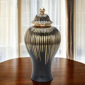 Homeroots 12" Black And Gold Striped Urn Ceramic Ginger Jar - Chic Decorative Accent For Modern Interiors  Ceramic 571631