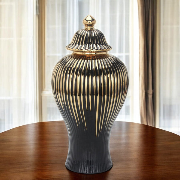 Homeroots 12" Black And Gold Striped Urn Ceramic Ginger Jar - Chic Decorative Accent For Modern Interiors  Ceramic 571631