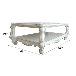 Homeroots 57" White Wood Ornate Coffee Table With Shelf - Chic Design For Stylish Storage & Home Decor!   572270