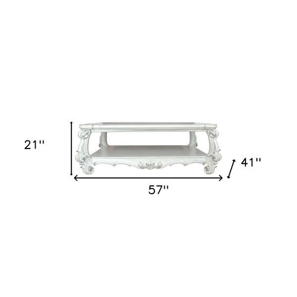 Homeroots 57" White Wood Ornate Coffee Table With Shelf - Chic Design For Stylish Storage & Home Decor!   572270