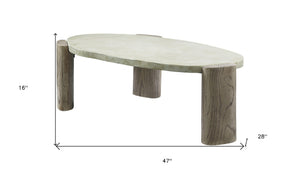 HomeRoots 47" Rustic Oval Cement Coffee Table with Distressed Beige Top & Warm Oak Legs for Modern Living Spaces 572275
