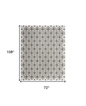 HomeRoots 6' X 9' Ivory and Black Geometric Area Rug - Durable, Stylish Indoor/Outdoor Floor Covering for Any Space 572909