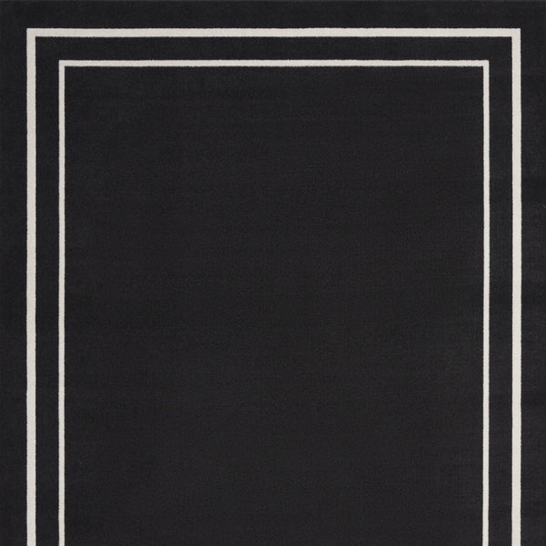 HomeRoots 7' Timeless Black and Ivory Indoor/Outdoor Area Rug - Durable, Stylish, Low-Maintenance Décor Essential 573054