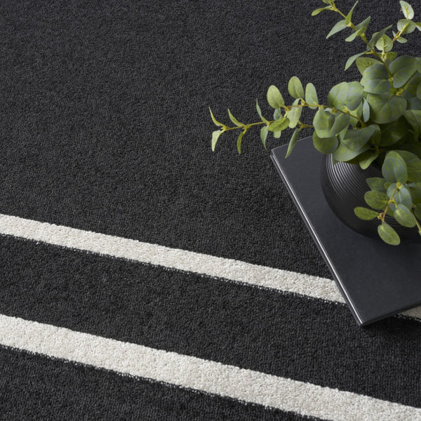 HomeRoots 7' Timeless Black and Ivory Indoor/Outdoor Area Rug - Durable, Stylish, Low-Maintenance Décor Essential 573054
