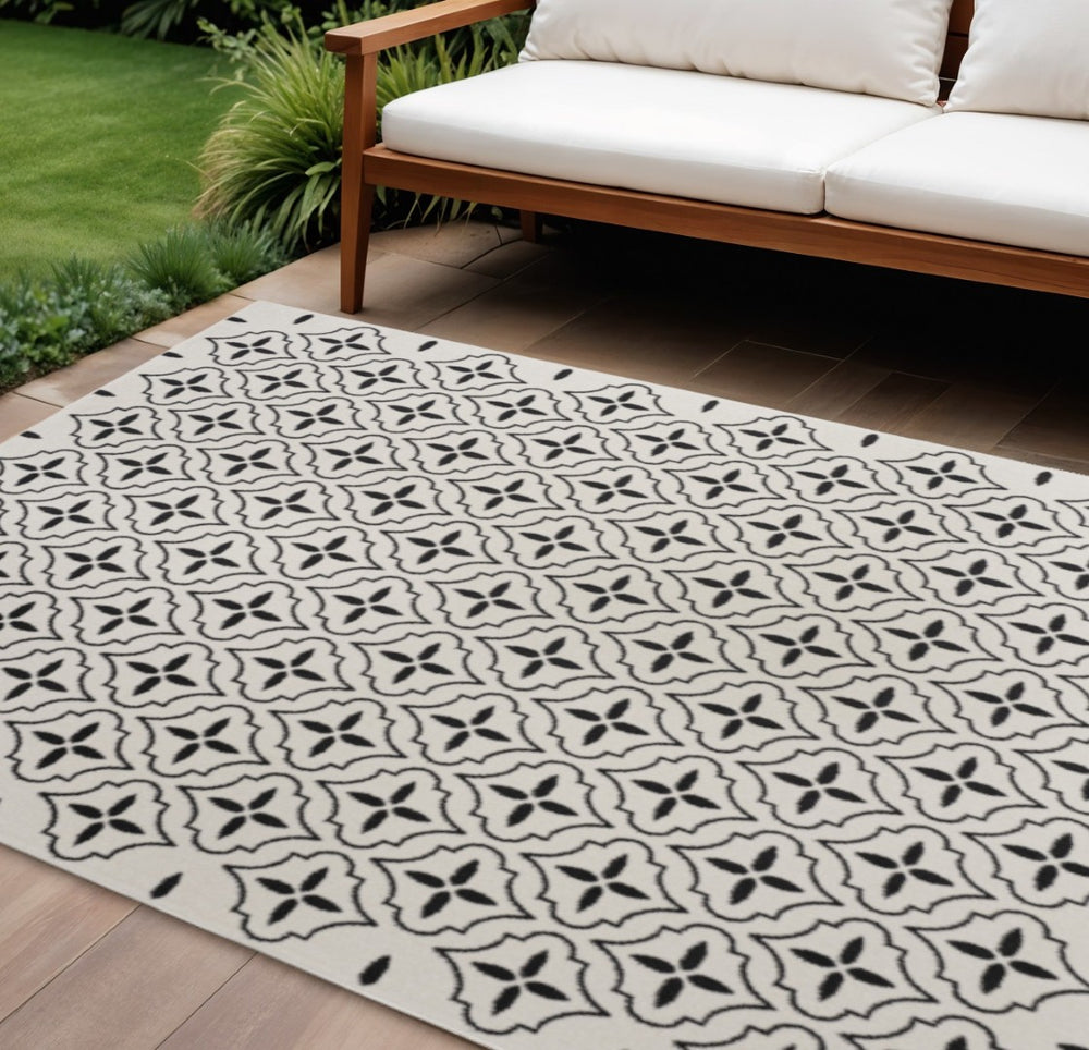 HomeRoots 8' X 10' Ivory and Black Geometric Area Rug – Stylish, Weather-Resistant for Indoor/Outdoor Spaces 573069