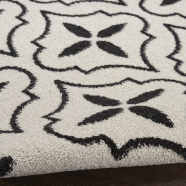 HomeRoots 8' X 10' Ivory and Black Geometric Area Rug – Stylish, Weather-Resistant for Indoor/Outdoor Spaces 573069