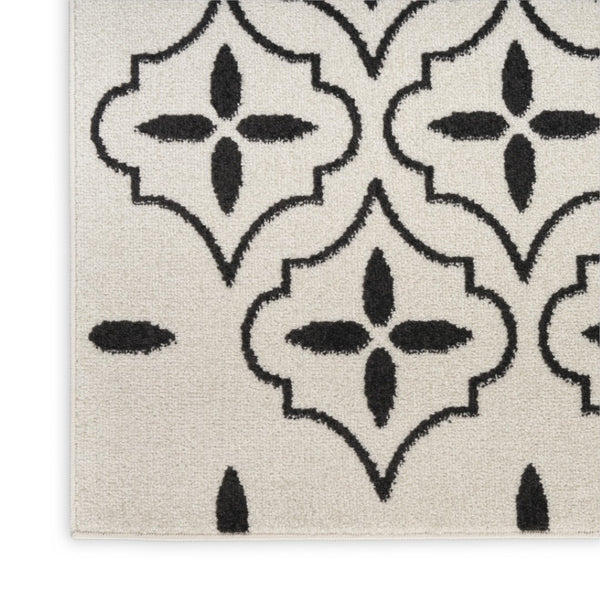 HomeRoots 8' X 10' Ivory and Black Geometric Area Rug – Stylish, Weather-Resistant for Indoor/Outdoor Spaces 573069