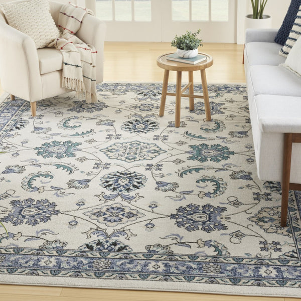 HomeRoots 10' Ivory and Blue Floral Area Rug – Elegant Indoor/Outdoor Carpet for Living Spaces & Patios 573237