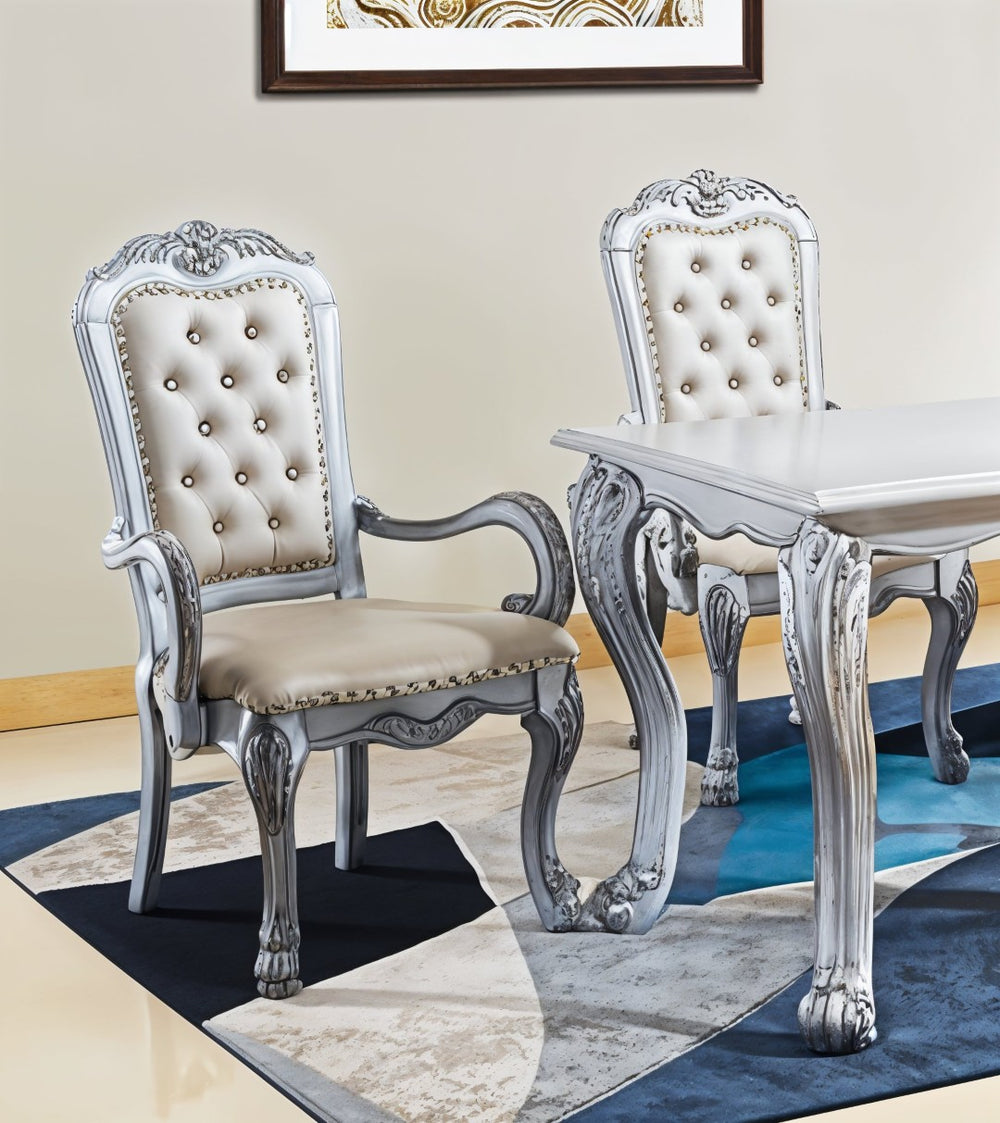 HomeRoots Set of Two Elegant Tufted White Faux Leather Dining Armchairs with Wood Legs for Versatile Use 573331
