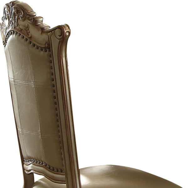 HomeRoots Set of Two Elegant Tufted Faux Leather Dining Side Chairs with Brass Accents for Modern Spaces 573393
