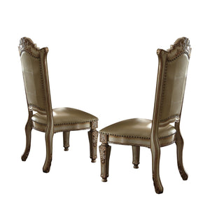 HomeRoots Set of Two Elegant Tufted Faux Leather Dining Side Chairs with Brass Accents for Modern Spaces 573393
