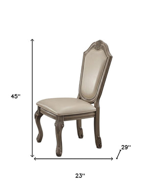 HomeRoots Set of Two Elegant Antiqued White Faux Leather Dining Chairs with Supportive Queen Anne Legs 573412