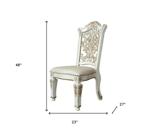 HomeRoots Set of Two Elegant Dark Blue Faux Leather Dining Chairs with Pearl Legs & Nailhead Trim Design 573417