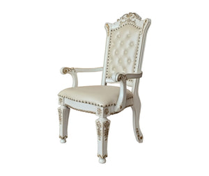 HomeRoots Set of Two Elegant Tufted Dark Blue Faux Leather Dining Arm Chairs with Pearl Legs for Comfort 573418