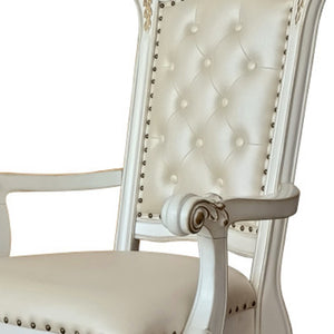 HomeRoots Set of Two Elegant Tufted Dark Blue Faux Leather Dining Arm Chairs with Pearl Legs for Comfort 573418