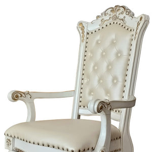 HomeRoots Set of Two Elegant Tufted Dark Blue Faux Leather Dining Arm Chairs with Pearl Legs for Comfort 573418