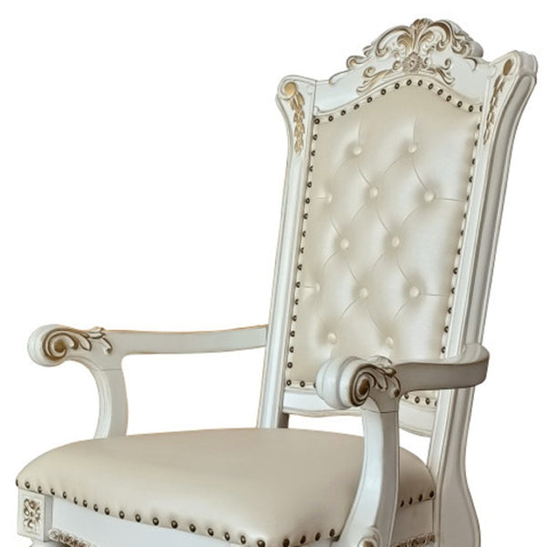HomeRoots Set of Two Elegant Tufted Dark Blue Faux Leather Dining Arm Chairs with Pearl Legs for Comfort 573418