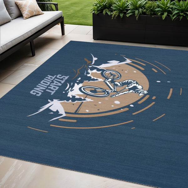 HomeRoots 5' Mountain Biker Area Rug – Vibrant Blue, Gold & White Design for Kids' Rooms, Easy Care & Durable 5' X 7' 573682