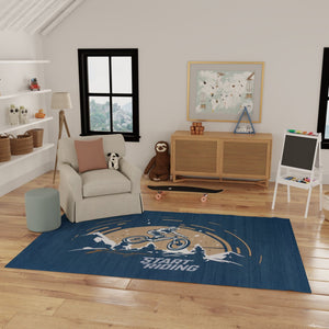 HomeRoots 5' Mountain Biker Area Rug – Vibrant Blue, Gold & White Design for Kids' Rooms, Easy Care & Durable 7' X 9' 573709