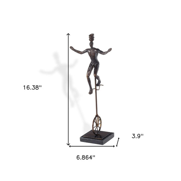 HomeRoots 16" Bronze Resin Unicycle Man Sculpture - Whimsical Art for Stylish Tabletop Décor & Gift Ideas 574103
