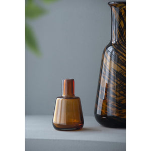 HomeRoots Set of Three Amber Swirl Glass Bottles with Stoppers – Stylish Decor for Any Space, Gift-Ready! 574229
