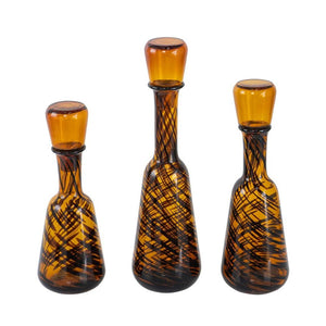 HomeRoots Set of Three Amber Swirl Glass Bottles with Stoppers – Stylish Decor for Any Space, Gift-Ready! 574229
