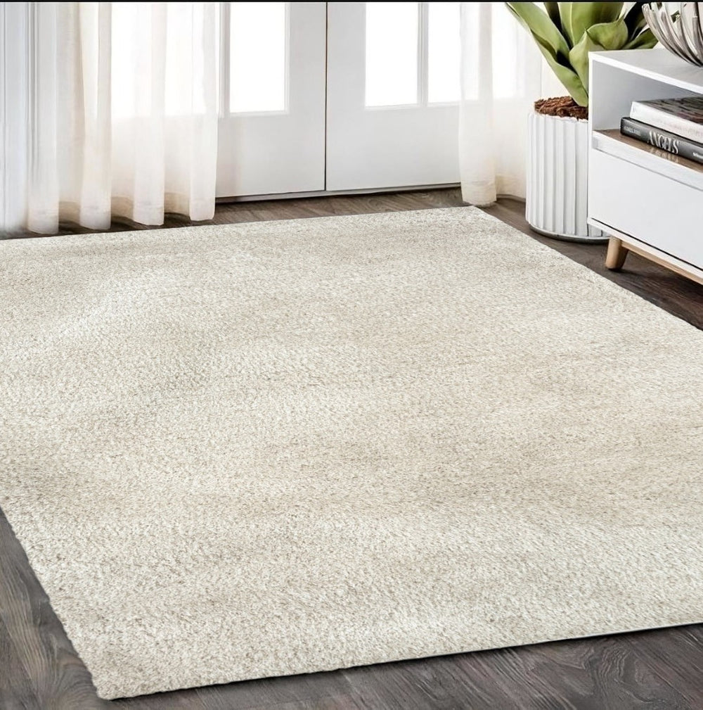 HomeRoots 5' Plush Ivory Shag Area Rug - Hand-Tufted Luxury, Stain-Resistant, Soft Cotton Backing for Comfort 5' X 7' 574428