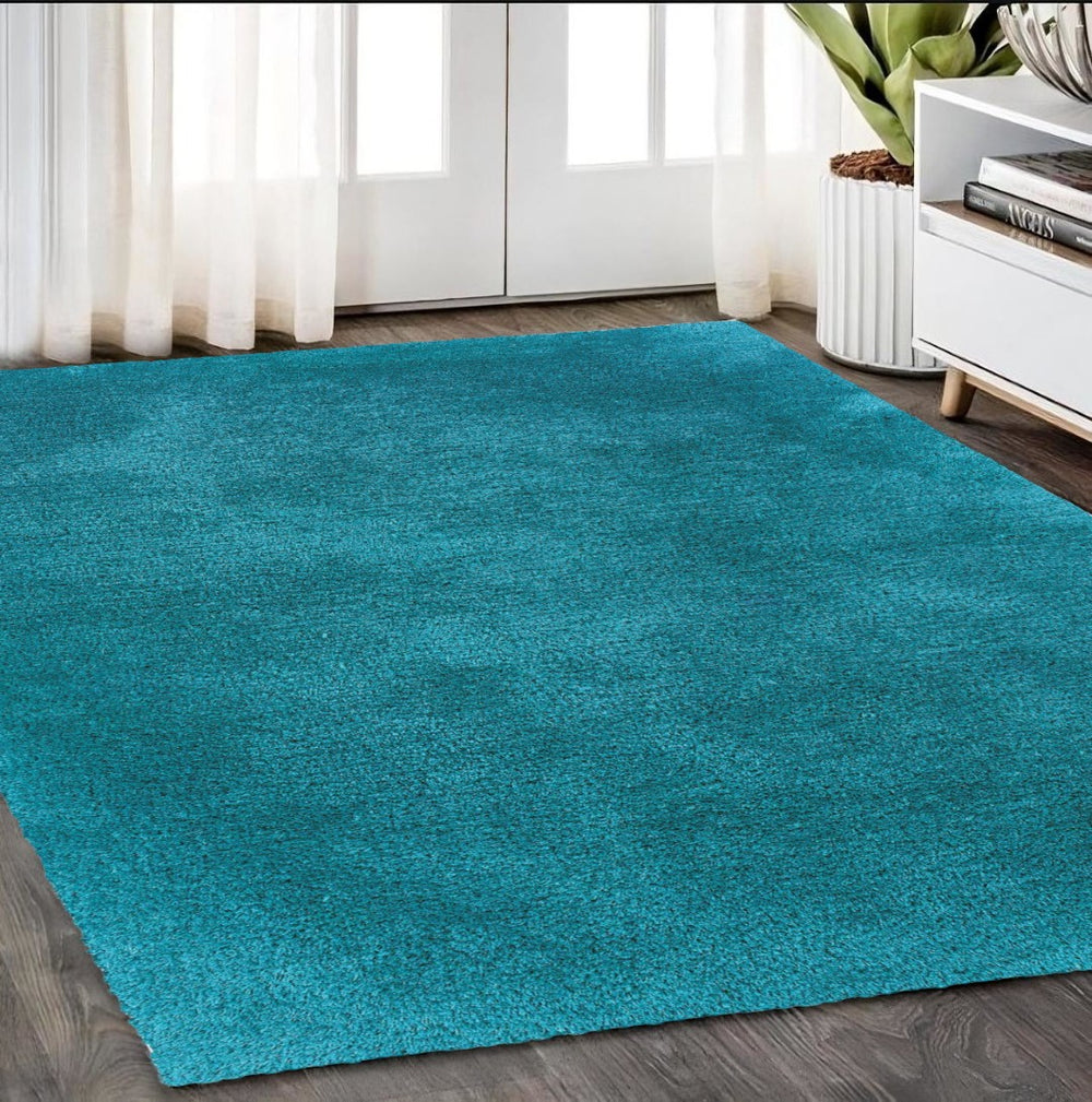 HomeRoots 5' Vibrant Teal Shag Area Rug - Luxurious Hand-Tufted Comfort for Modern Living Rooms & Bedrooms 5' X 7' 574441