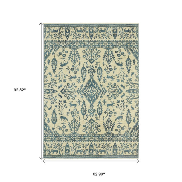 HomeRoots 5' Elegant Ivory and Blue Oriental Area Rug with Fringe - Stain Resistant, Ideal for Any Room 5' X 8' 574605