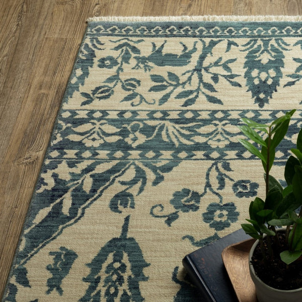 HomeRoots 5' Elegant Ivory and Blue Oriental Area Rug with Fringe - Stain Resistant, Ideal for Any Room 7' X 10' 574607