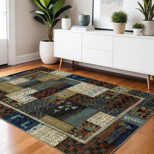 Homeroots 5' Artistic Blue Patchwork Area Rug - Stain Resistant, Perfect For Kids & Pets, Adds Warmth To Home 4' X 6' Polypropylene 574672