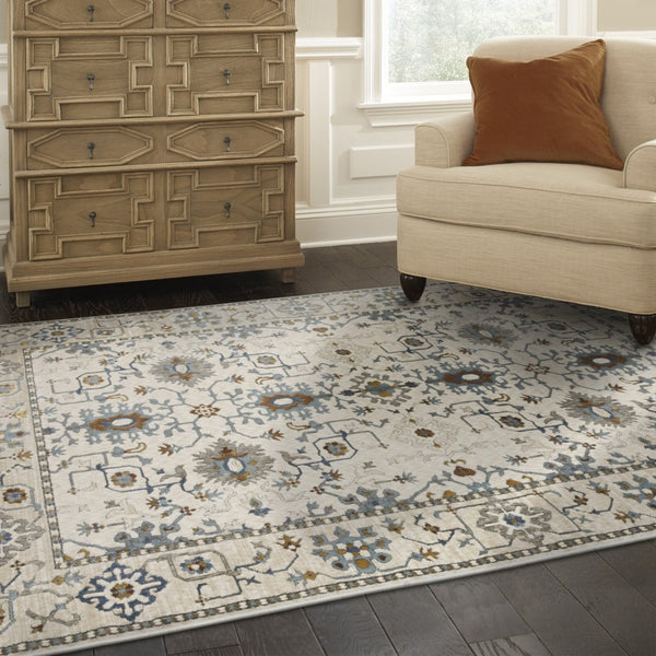 HomeRoots 5' Elegant Ivory Oriental Area Rug with Burnt Orange and Blue Accents - Stain & Fade Resistant 5' X 8' 574814