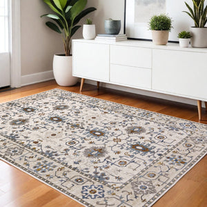 HomeRoots 5' Elegant Ivory Oriental Area Rug with Burnt Orange and Blue Accents - Stain & Fade Resistant 4' X 6' 574816