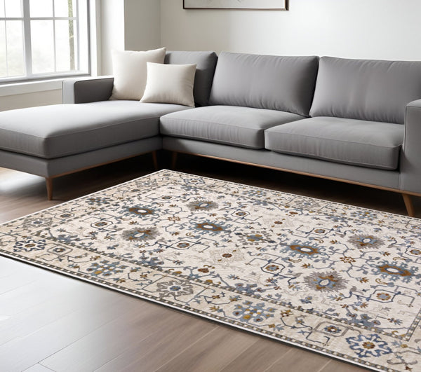 HomeRoots 5' Elegant Ivory Oriental Area Rug with Burnt Orange and Blue Accents - Stain & Fade Resistant 8' X 11' 574818