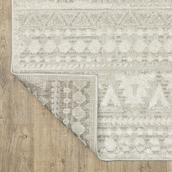 HomeRoots 5' Beige and Ivory Tribal Area Rug - Durable, Stain-Resistant Design for Stylish Living Spaces 5' X 8' 574819