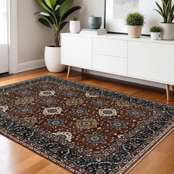 HomeRoots 5' Red Medallion Area Rug with Fringe - Elegant, Stain-Resistant Design for Stylish Living Spaces! 4' X 6' 574863