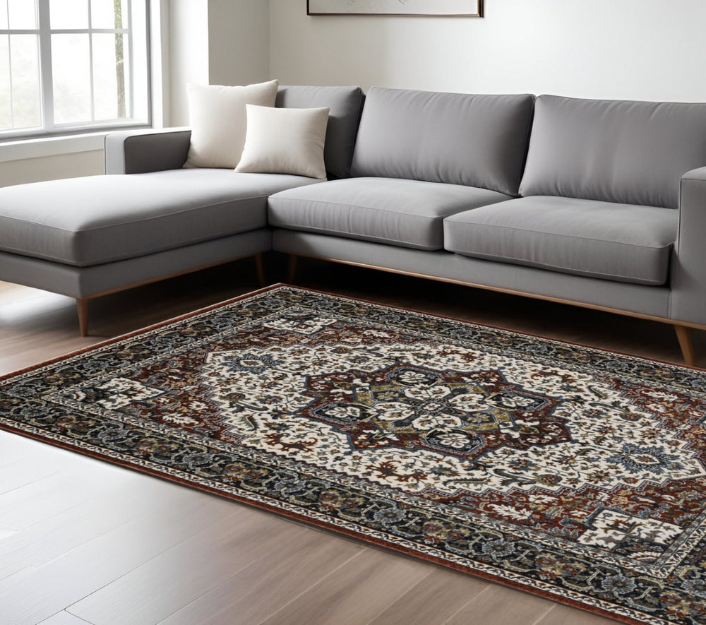 HomeRoots 10' Bold Red, Black, and White Medallion Area Rug with Fringed Edges - Durable & Stain-Resistant Design 10' X 13' 574876