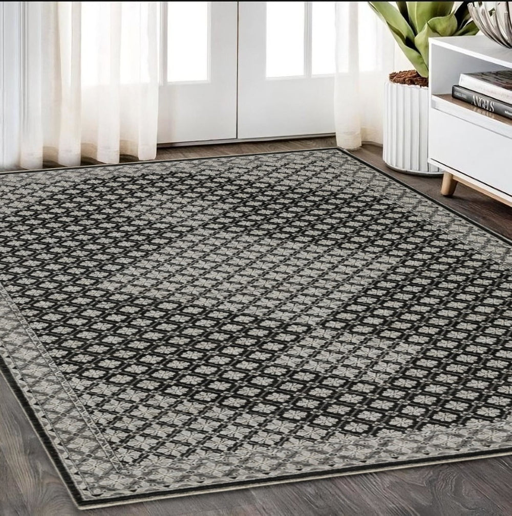 HomeRoots 5' Modern Black and Gray Diamond Area Rug with Stylish Fringe for Durable, Cozy Living Spaces 5' X 8' 574885